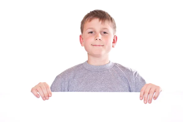Happy teenage boy holding a blank form — Stock Photo, Image