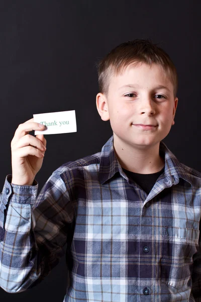 Boy shows a card with gratitude — Stock Photo, Image