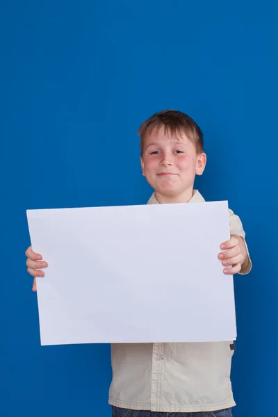Boy holding a blank — Stock Photo, Image
