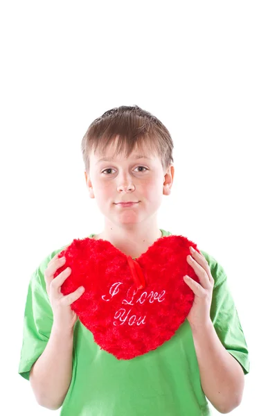 Pojken håller ett hjärta — Stockfoto