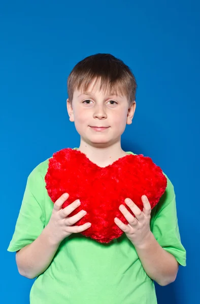 Boy holding a heart — Stock Photo, Image