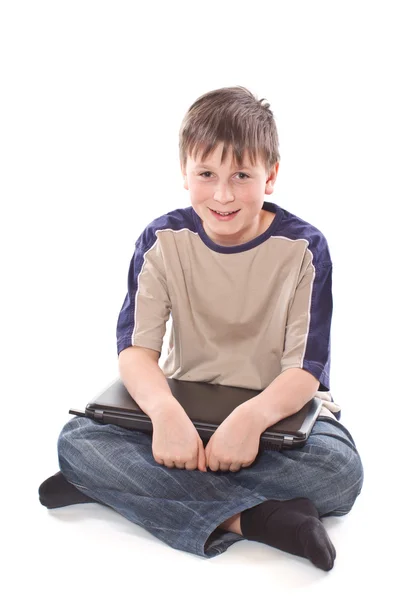 Teenage boy with a laptop — Stock Photo, Image