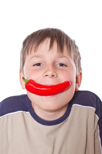 Chlapec s papriky — Stock fotografie