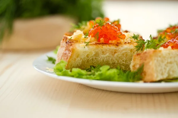 Fried toast with cheese and red caviar — Stock Photo, Image