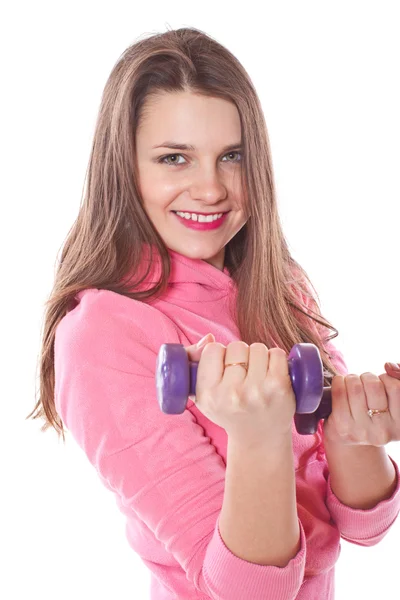 Ragazza è impegnata in fitness con manubri — Foto Stock