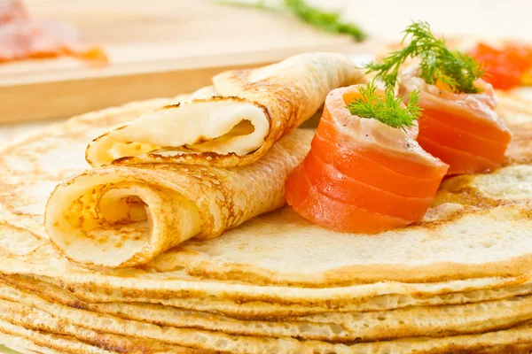 Pancakes with salted salmon — Stock Photo, Image