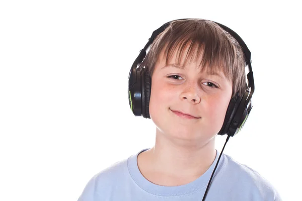Boy listening to music with headphones — Stock Photo, Image