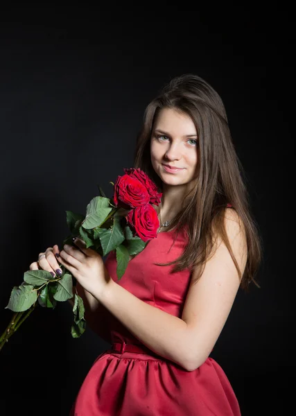 Beautiful girl with roses — Stock Photo, Image