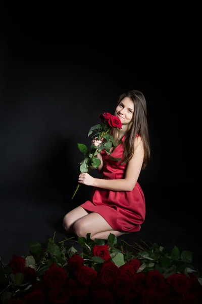 Beautiful girl with roses — Stock Photo, Image