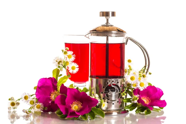 Tea with rose hips with flowers — Stock Photo, Image