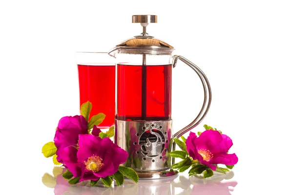 Tea with rose hips with flowers — Stock Photo, Image