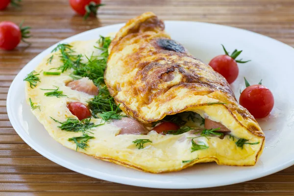 Scrambled eggs with tomatoes Stock Picture