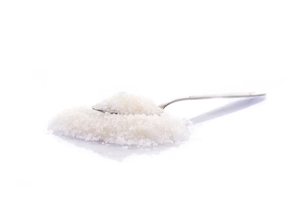 Κρυσταλλική ζάχαρη σε ένα κουτάλι — Φωτογραφία Αρχείου
