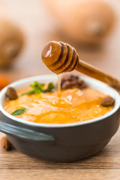 Pumpkin porridge with honey — Stock Photo, Image
