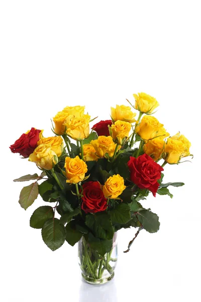 Yellow and red roses in a vase — Stock Photo, Image