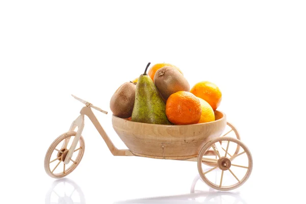 Fresh fruit ride a tricycle wooden bike — Stock Photo, Image