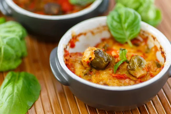 Brussels sprouts baked in tomato sauce — Stock Photo, Image