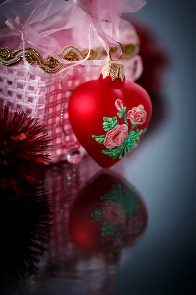 Christmas red hearts with red garland — Stock Photo, Image