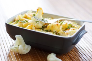 cauliflower baked with egg and cheese clipart