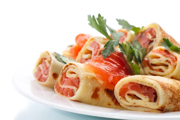 Thin pancakes with salted red fish — Stock Image Thin pancakes with salted red fish Royalty Free Stock Photos