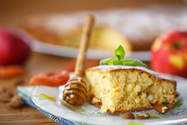 Sponge cake with dried apricots and almonds — Stock Photo, Image