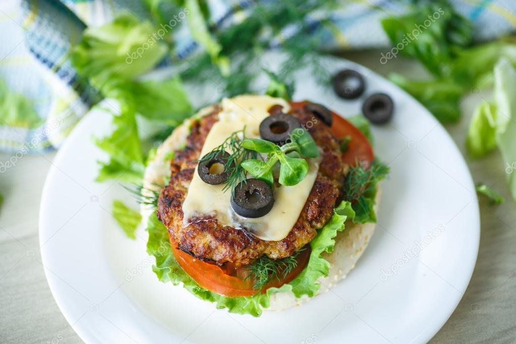 tasty hamburger with lettuce and tomato