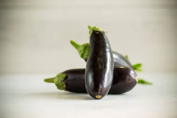 Raw Fresh Ripe Eggplants Light Wooden Table — Stock Photo, Image