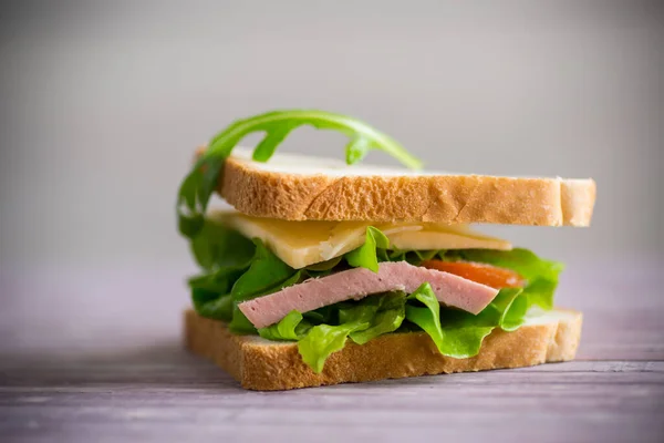 Sandwich Various Greens Cheese Sausage Tomato Wooden Table — Stock Photo, Image