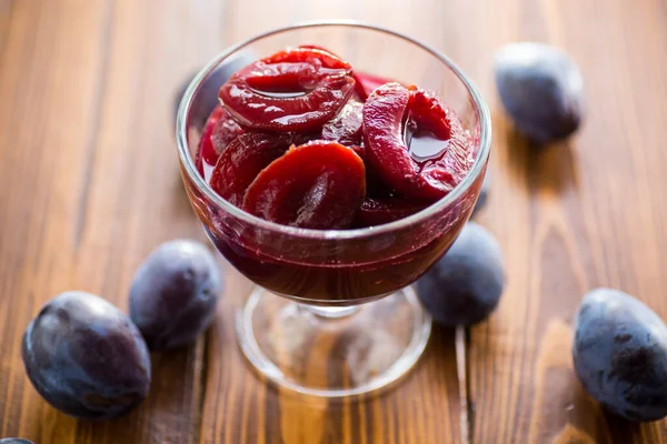 Sweet Plums Syrup Glass Bowl Wooden Table — Stock Photo, Image