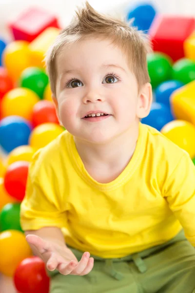 Cute kid or child playing colorful balls top view — Stock Image Cute kid or child playing colorful balls top view Royalty Free Stock Images