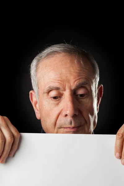 Old man with a blank paper — Stock Photo, Image