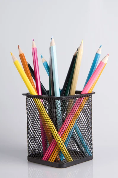 Colorful pencils in a holder on a white background close-up — Stock Photo, Image