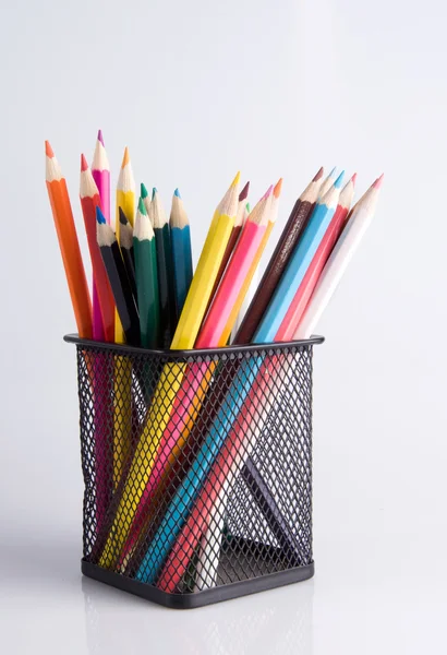 Colorful pencils in a holder on a white background close-up — Stock Photo, Image