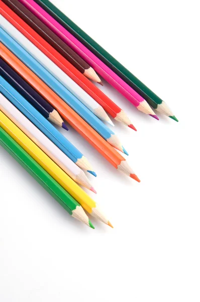 Färgglada pennor på en vit bakgrund närbild — Stockfoto
