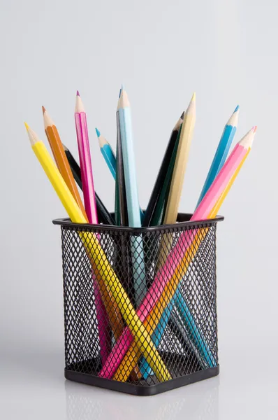 Colorful pencils in a holder on a white background close-up — Stock Photo, Image