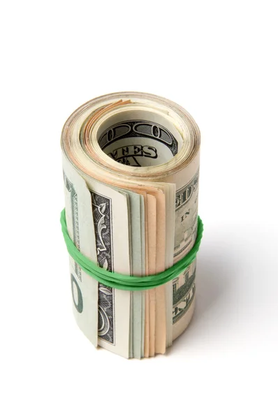 Pack of dollars is twisted into a roll — Stock Photo, Image