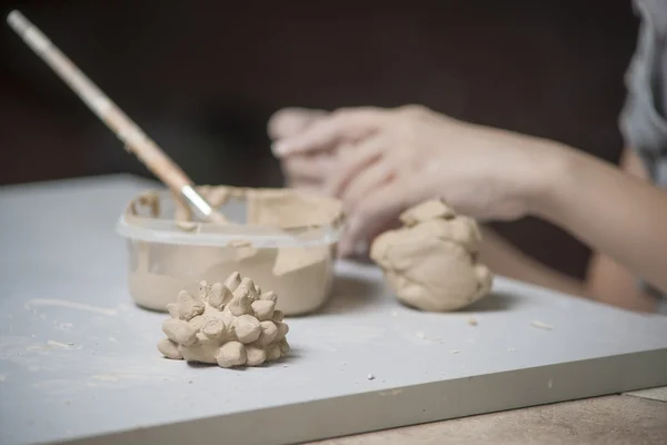 Girl make toy from clay — Stock Photo, Image