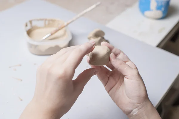 Girl make toy from clay — Stock Photo, Image