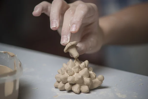 Girl make toy from clay — Stock Photo, Image