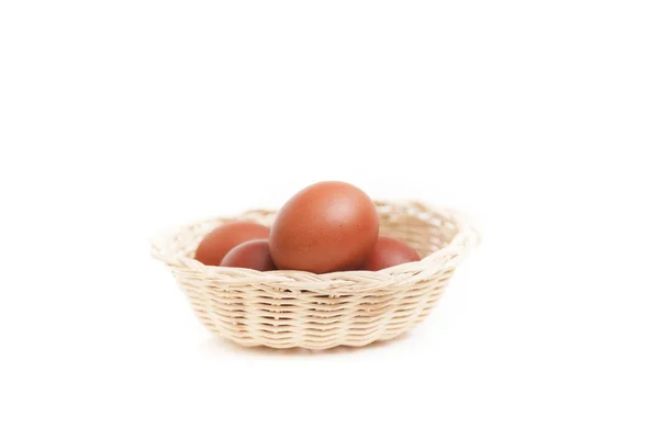 Brown eggs in the basket on white — Stock Photo, Image