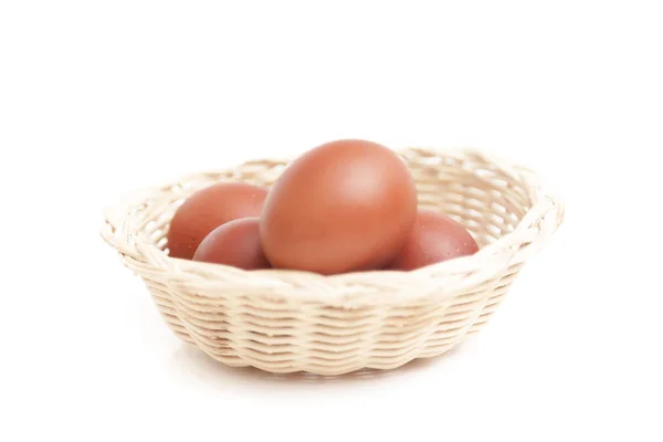 Brown eggs in the basket on white — Stock Photo, Image