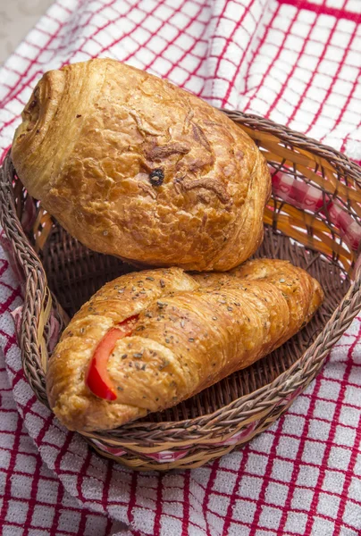 Chocolate croissants in a basket — Stock Photo, Image