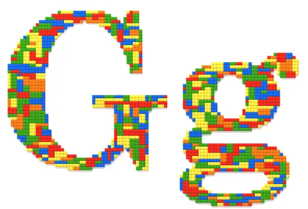 Litery g, zbudowany z cegły zabawka w przypadkowych kolorach — Zdjęcie stockowe