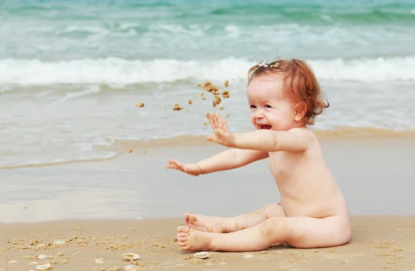 Aborable baby-girl on the beach — Stock Photo, Image