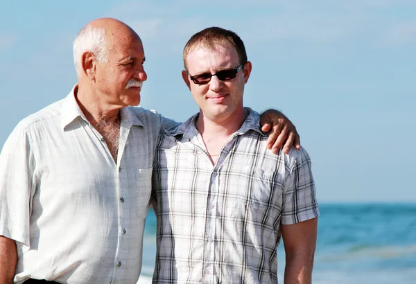 Father and son on a beach — Stock Photo, Image
