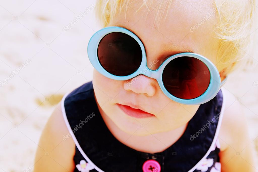 Portrait of cute 1,5 years old baby with fashin vintage sunglass
