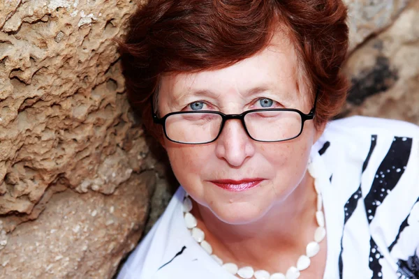 Portrait of 60-years-old beautiful woman outdoors — Stock Photo, Image