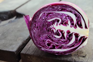 red Cabbage on wooden background clipart