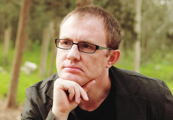 Handsome 35 years old man with glasses outdoors — Stock Photo, Image