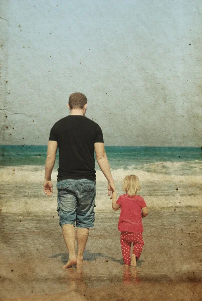 Father and daughter on the beach. Photo in old image style. — Stock Photo, Image